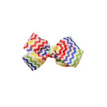 Load image into Gallery viewer, Rainbow Chevron 1.5in Grosgrain Hair bow Made with an alligator Hair clip or elastic headband