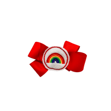 Load image into Gallery viewer, Red hair bow with rainbow embroidered center 1.5in Grosgrain Hair bow . Made with an alligator Hair clip or elastic headband
