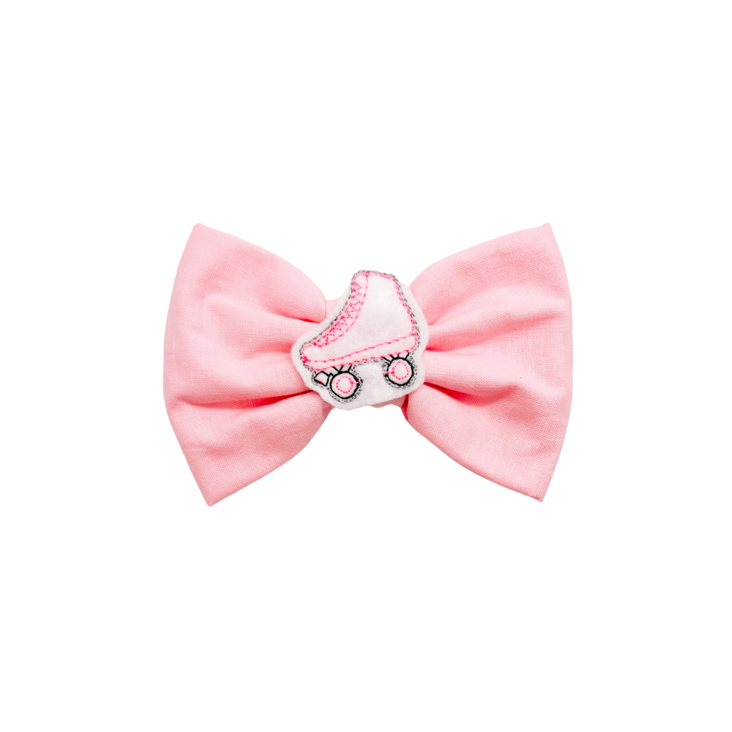 Light Pink Bow Tie with embroidered roller skate feltie center made with Alligator hair clip, over the collar or elastic headband (2 sizes available)