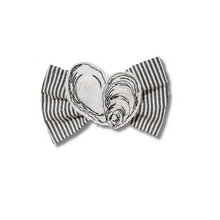 Load image into Gallery viewer, Oyster on seersucker Feltie Bow Tie made with Alligator hair clip, over the collar or elastic headband (2 sizes available)
