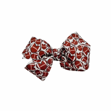 Load image into Gallery viewer, Football Hearts 1.5in Grosgrain Hair bow  Made with an alligator Hair clip or elastic headband
