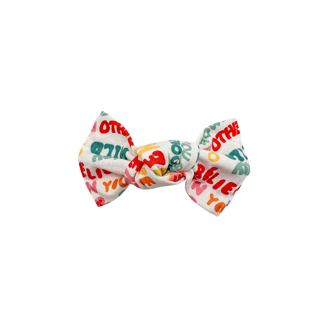 Groovy words knotted bow made with Alligator hair clip or elastic headband